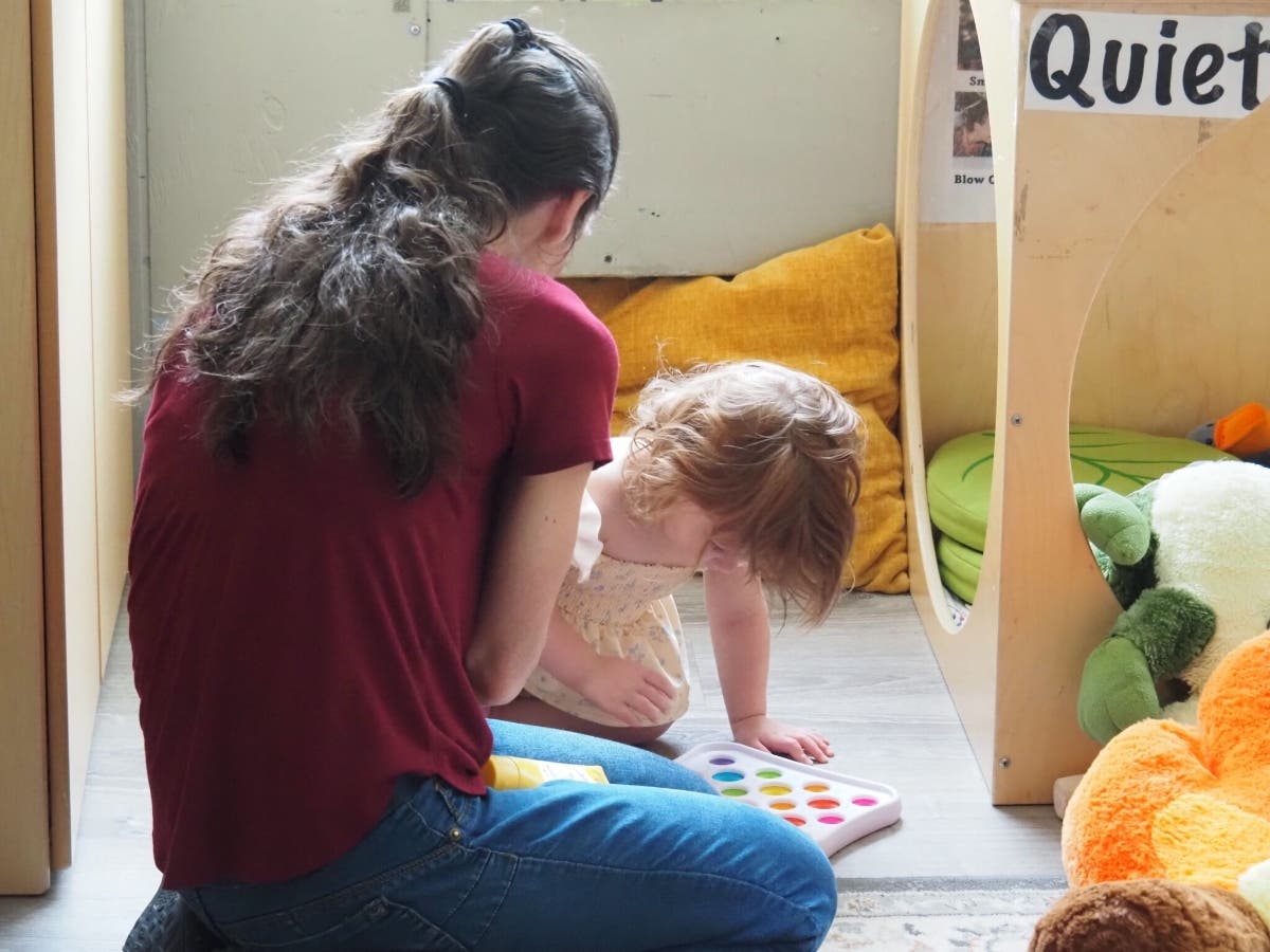 A childcare provider playing at Rochester Child Care Center. Over the past few days, the federal government and the Department of Health and Human Services gave a clear response on funding for the childcare workforce grant.
