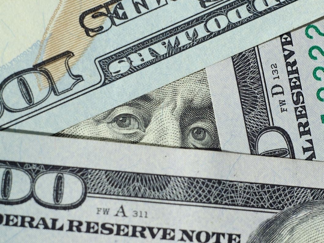 Macro photo of banknotes of money in the US currency one hundred dollars.
