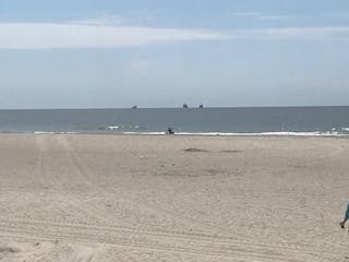 Those who visit Long Beach this summer won't face 100 percent beach capacity as they keep an eye on social distancing. 