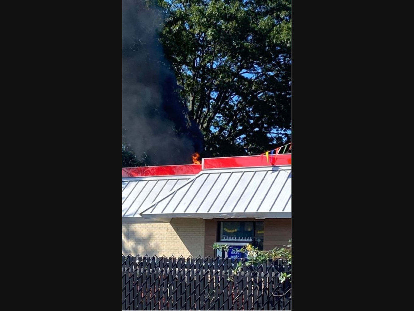 Fire is seen from the roof of the Burger King restaurant in Seaford.