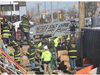 First responders pull a construction worker from the pile on Tuesday morning. 