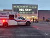 An ambulance takes the victim of an apparent gunshot wound at Green Acres Mall, police said.