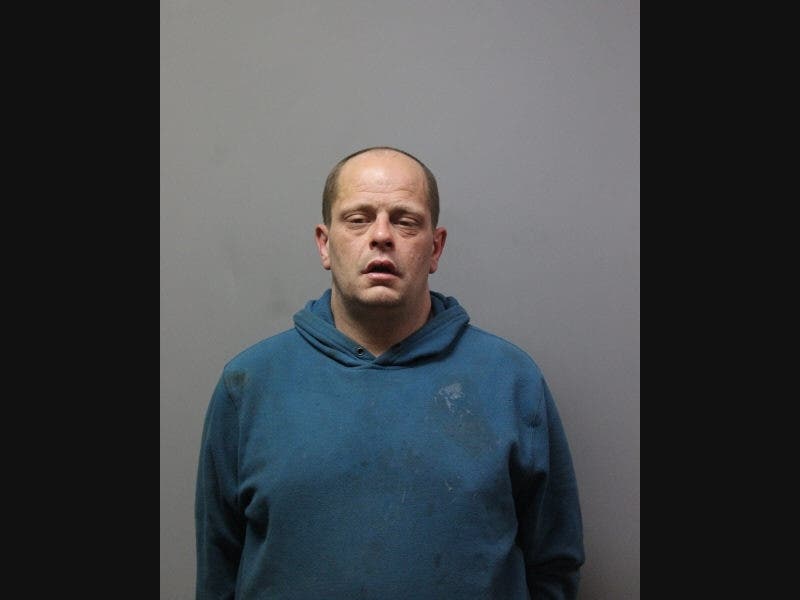 John Howell is accused of holding a man and woman hostage in a Hicksville home, police said.