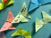 Origami butterflies made by students and other members of the Brandeis Hebrew Academy family have messages of support for the IDF and the hostages who remained captive. 