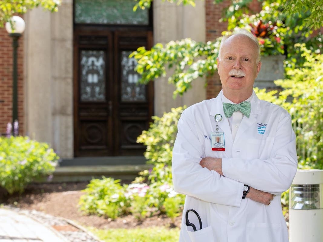 Greenwich Hospital oncologist Dickerman Hollister, MD – who will retire after four decades of service to the community – stands outside the Smilow Cancer Hospital Care Center in Greenwich.