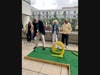 Mayor David Martin putting during the mini golf tournament on Sept. 9.