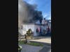The fire spread to an adjacent barbershop and apartment, according to the SFD.