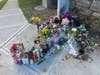 A growing memorial sits at the corner of Wendle Place and East Putnam Avenue in Old Greenwich.