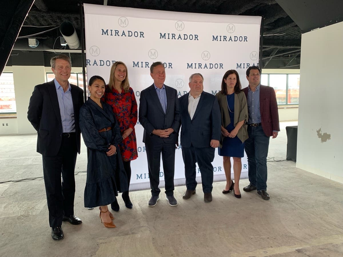 From left to right: Peter Denious, Loren Nadres, Mayor Caroline Simmons, Gov. Ned Lamont, Mirador CEO Joseph Larizza, Heidi Davis, David Lehman