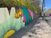 The mural is located along a stretch of the Post Road, across from Greenwich High School. It was painted by New York artist Nelson Rivas.