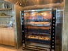 Patrons are greeted by a big rotisserie when they walk in. Potatoes are simultaneously roasting at the bottom.