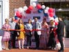 First Selectman Monica McNally and Rudy's Grooming Club owner Radouan "Rudy" Yazidi (center) at Thursday's ribbon-cutting ceremony.