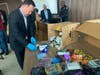 CT Attorney General William Tong surveys some of the many illegal delta-8 THC products seized from several Stamford smoke shops.