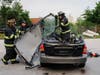 From left to right: Firefighter Joe Bell, 1st Asst. Chief Larry Castellani, and
Lt. Joey Romaniello remove the roof and windshield of a car using the new Holmatro Pentheon Series “jaws of life” tools.