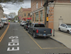 Two metered spaces would be eliminated and a new commercial loading zone would be created further up East Elm Street. Behind the two spaces is already a loading zone (in yellow) which is out of compliance with town ordinance, parking services said.