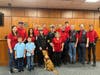 On Monday at Town Hall, now former Round Hill Volunteer Fire Company District Chief Rick Strain (center, white cap) was honored by his colleagues and the town for his decades of service.