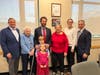 From left to right: Stephen Warzoha; Claire Warzoha; Dan Warzoha and his two children; Diane Warzoha; Kathryn Warzoha; and First Selectman Fred Camillo.