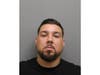 Juan Carlos Rodriguez, 27, of Bridgeport, turned himself in on a warrant at Darien police headquarters on June 17, police said.