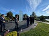 State Sen. Ryan Fazio (left) and First Selectman Fred Camillo (middle) walk up to the 9/11 memorial.