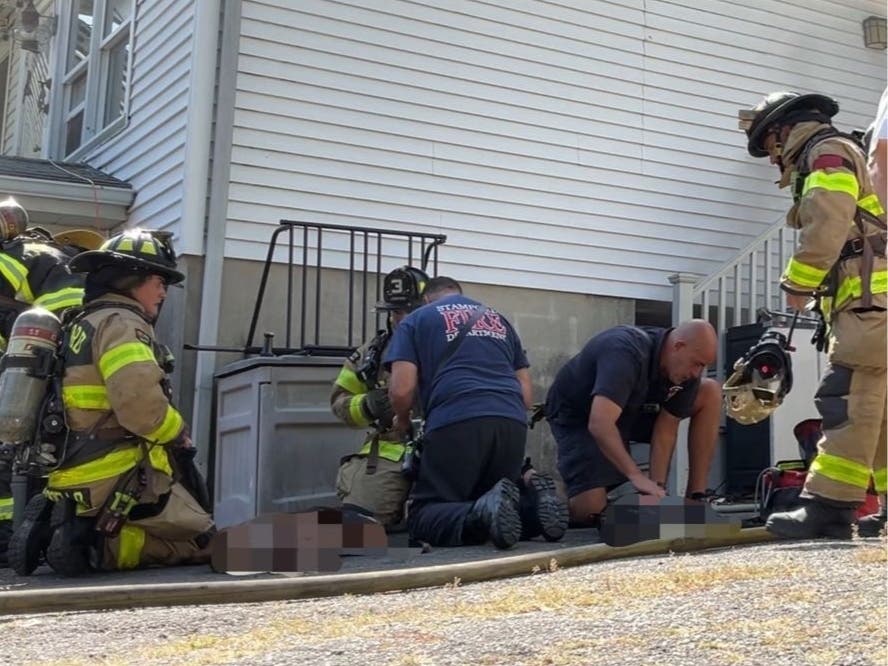 Firefighters were called to the home on Noble Street in the Waterside section of the city at 1:28 p.m. where they found heavy smoke coming from the basement, according to the Stamford Fire Department.