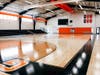 The Donovan Mitchell Family Athletic Center features a full-sized NCAA basketball court that can be divided in half to create two high school-sized courts.