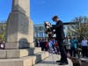 Former U.S. Navy Lt. William Fowler places a wreath at the base of the World War I monument in downtown Greenwich on Monday, Nov. 11, 2024.