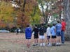 Local children observe a moment of silence as Greenwich Police Chief Jim Heavey lays a wreath honoring the nation’s fallen heroes.