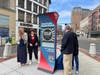 Stamford Mayor Caroline Simmons, Soofa co-founder and Vice President Jutta Friedrichs, and Stamford Downtown President Michael Moore unveiled one of five new digital kiosks in the downtown area on March 6, 2025.
