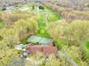 The home at 41 Londonderry Drive overlooks the fifth tee at Burning Tree Country Club.