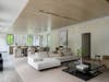 The home has oversized windows that allow natural light to come through.