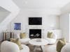 There are dual family rooms, a media room, private offices, and a composed primary suite.