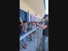 Student River Ruimy getting an autograph from artist Ian Soden in front of the wall that Whale Eye Woodworks of Indian Harbour Beach sponsored.