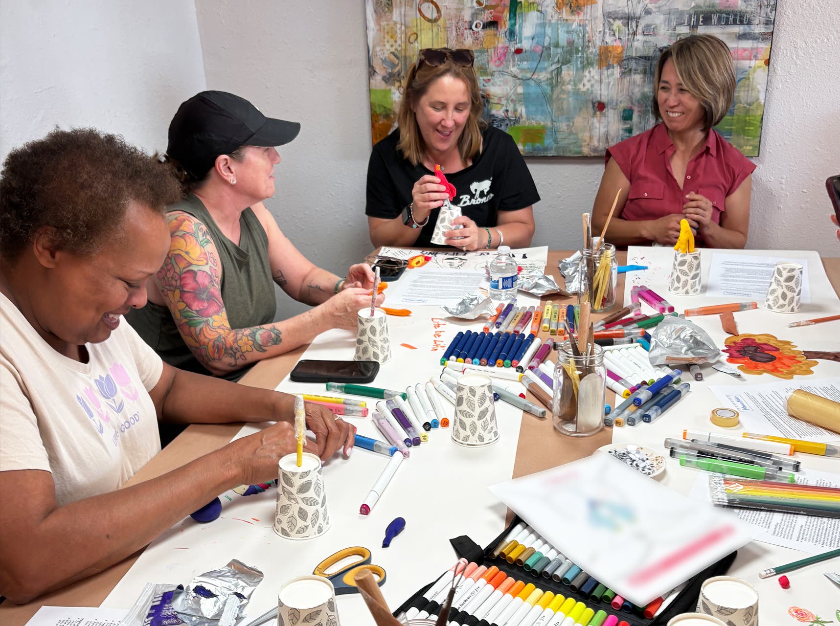 Women making art at a table