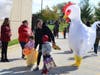 Someone donning a giant chicken costume helped officers welcome visitors at the trunk-or-treat event Saturday.