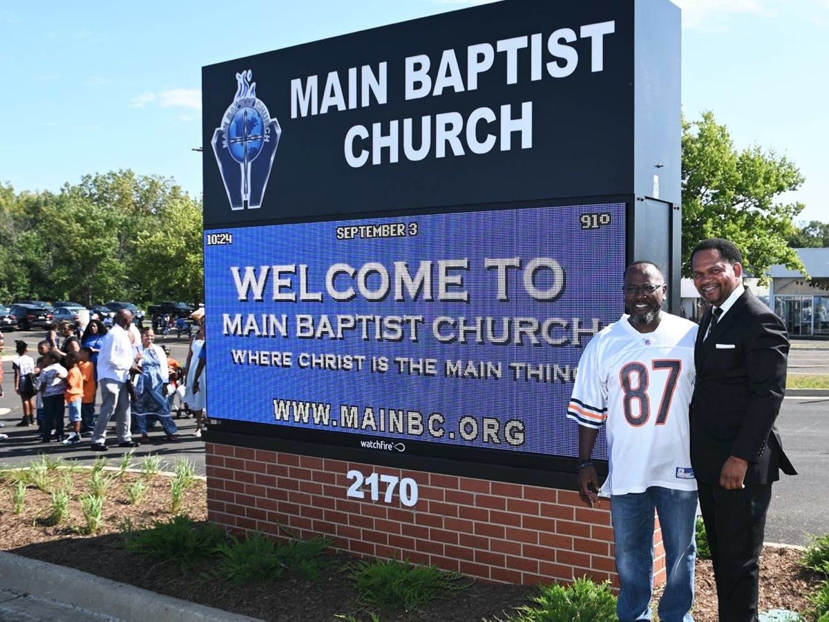 Main Baptist Church Senior Pastor Dr. Julian Spencer (left) and Mayor Richard Irvin stand next to the new digital sign unveiled Sunday at Main Baptist Church's ribbon-cutting ceremony.