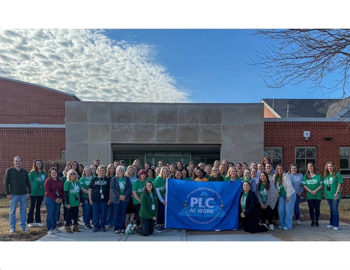 Central Elementary School in Plainfield, whose students and staff pose for a picture, was recently named a Model Professional Community at Work.