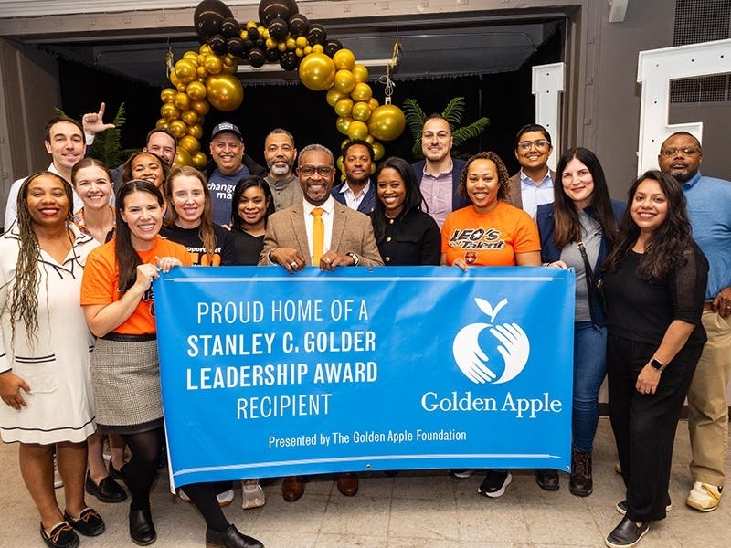 Shaka Rawls (center) was the recipient of the 2026 Golden Apple Award for Excellence in Leadership. A Class of 1999 graduate, he now serves as the principal of Leo High School in Chicago.
