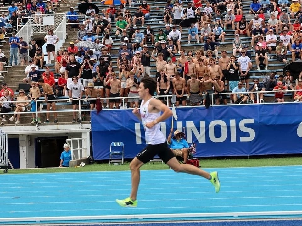 Plainfield North High School 2026 graduate Aidan Connors powers down the final stretch of the 3,200-meter run May at Eastern Illinois University.