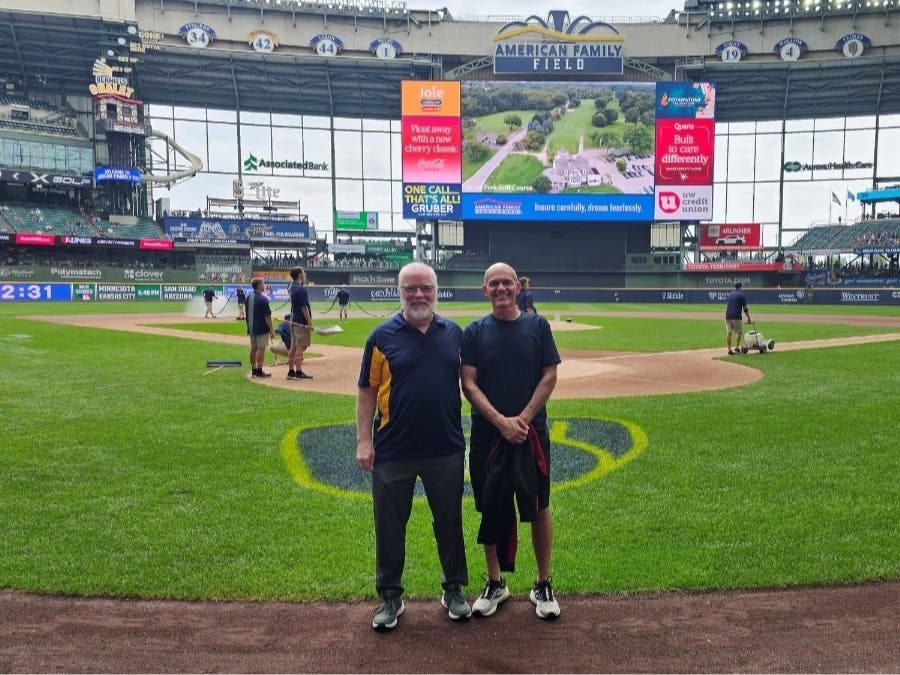 Curtis Compton (left) poses for a photo with his son, Ramiro, at a Milwaukee Brewers game Aug. 6 at American Family Field in Milwaukee, Wisconsin.