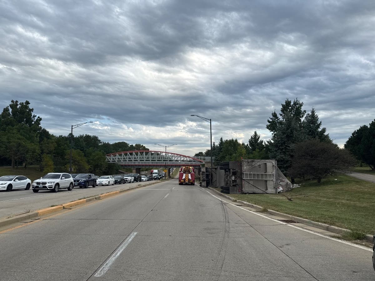 Orchard Road was closed for several hours Tuesday after a crash caused a garbage truck to tip over and spill a "significant amount" of waste, Aurora police said.