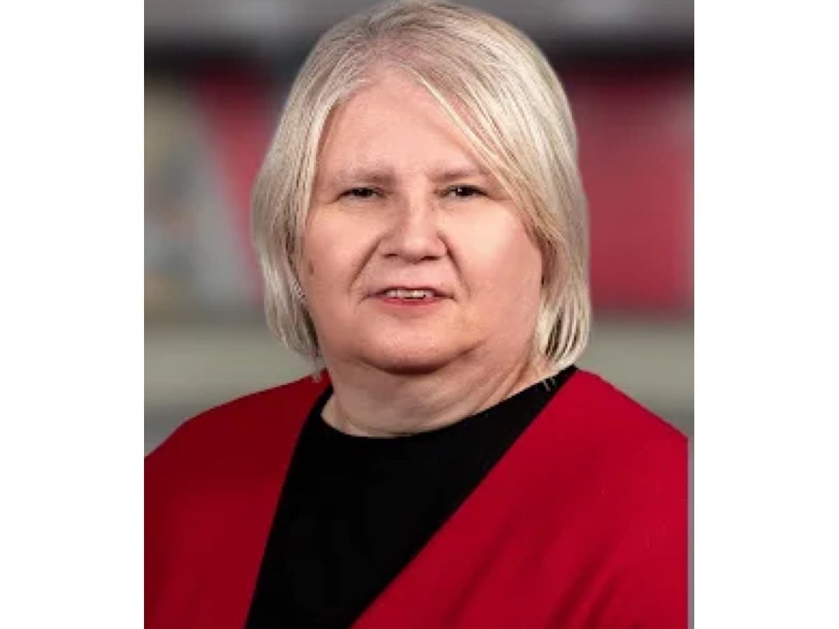 Annette Johnson is accused of accepted the payment from one of the companies she worked for in exchange for using her position to push the district to make a $2.7 million purchase of wearable air purifiers, Aurora officials said.