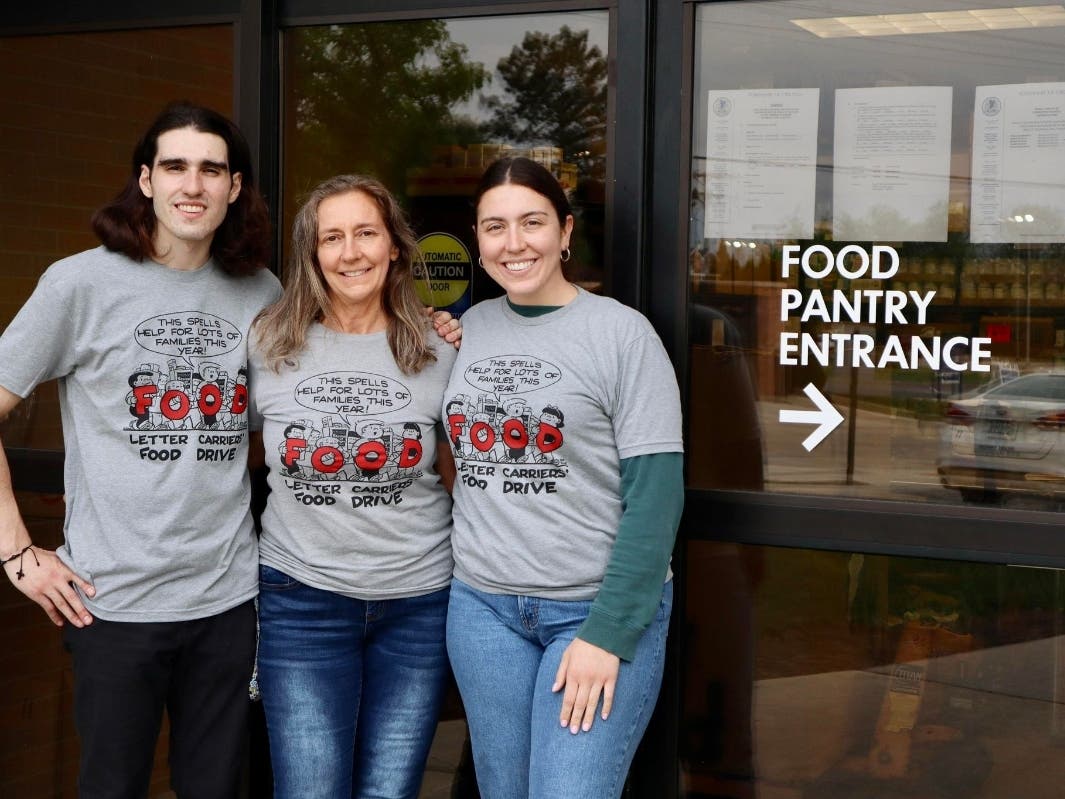 Robin Kassis (middle), with two of her children, Jonathan and Taylor, after the 2023 Stamp Out Hunger Food Drive.