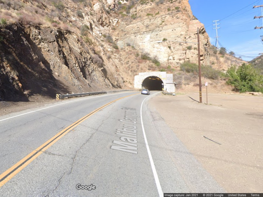 Malibu Canyon Road is reduced to one lane near the tunnel due to rocks in the road. 