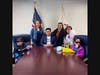 Alex Zapien meets with a Township family in his new office