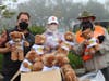 Davis Vice Mayor Lucas Frerichs, First 5 Executive Director Gina Daleiden, and Yolo County Supervisor Don Saylor pose with teddy bears that were distributed to every vaccinated child.