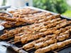 Chicken souvlaki grilling over the coals.