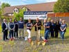 Ellafi FCU Board Chairman, Jim Misenti (center), stands next to Co-Acting CEOs Betsy Sommers (left) and Robyn Swanson (right) with shovels. They are joined by members of Ellafi’s Supervisory Committee and staff at the 562 South Main Street site.
