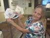 Linda Ozmin, Porter Place resident, shares her bra creation to honor breast cancer survivors.