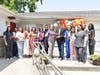 Allied Physicians Group CEO Dr. Kerry Firestein (seventh r) joins Doctors and staff in cutting the ribbon for the grand opening of the new Allied Physicians Group office in Elmont.