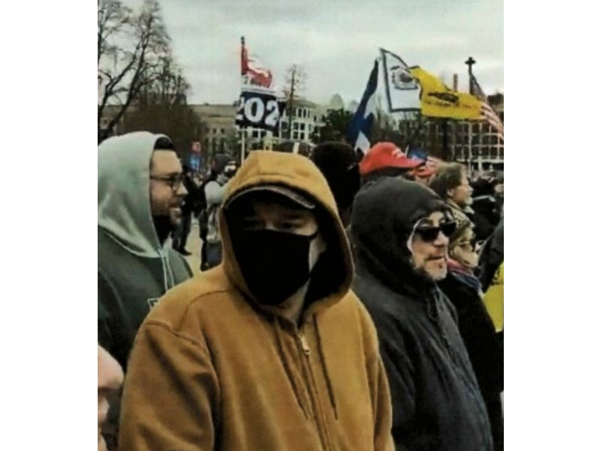 The U.S. Department of Justice says this image shows Nicholas Krauss, Russell Dodge Jr., and David Krauss near the Capitol Reflecting Pool during the attempted insurrection at the U.S. Capitol on Jan. 6, 2021. All three face federal charges.